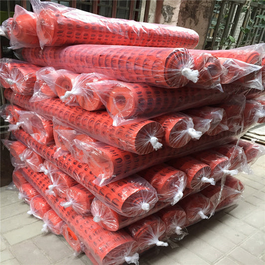 How can we ensure that plastic safety fences do not tip over or break in wind and rain?